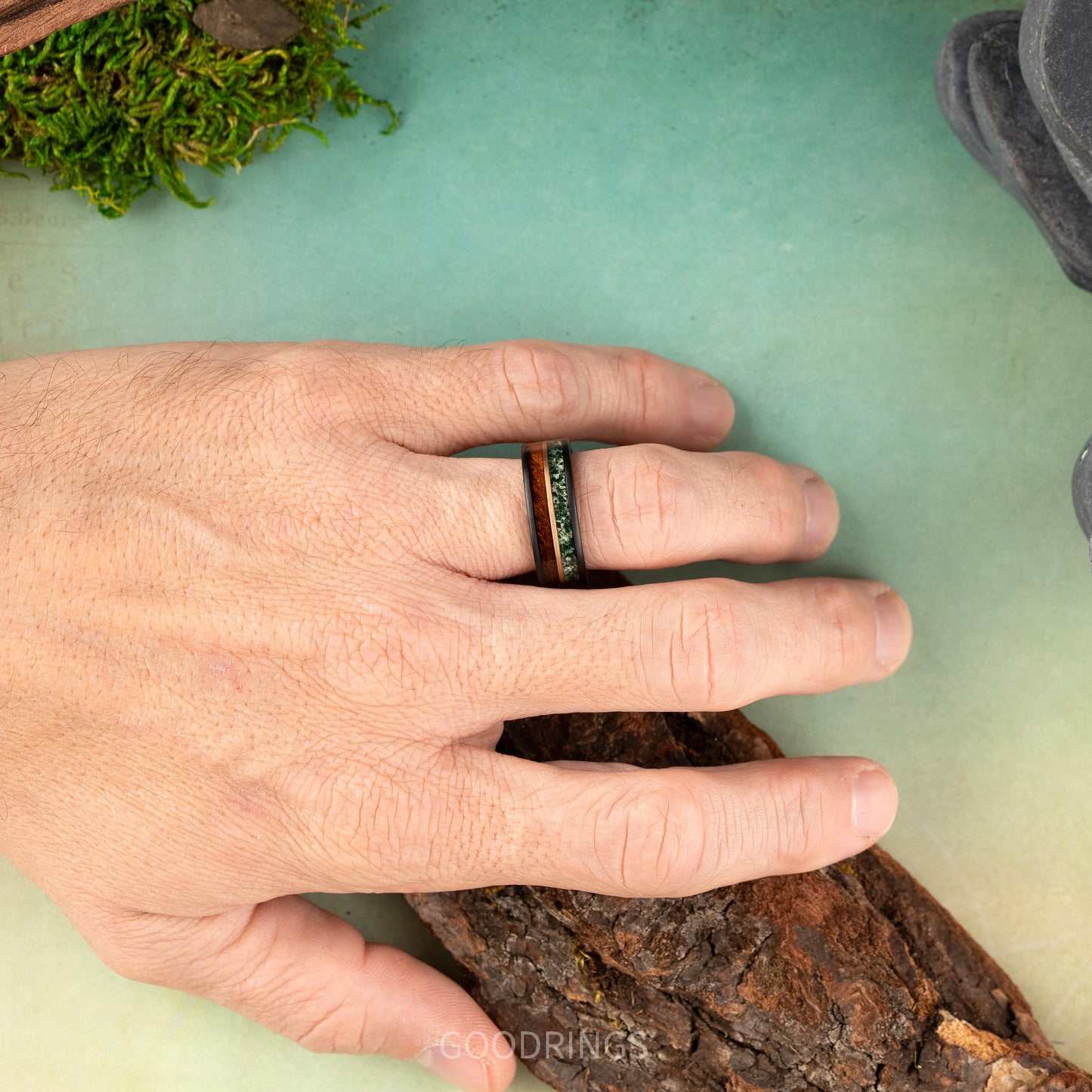 Moss agate ring on hand