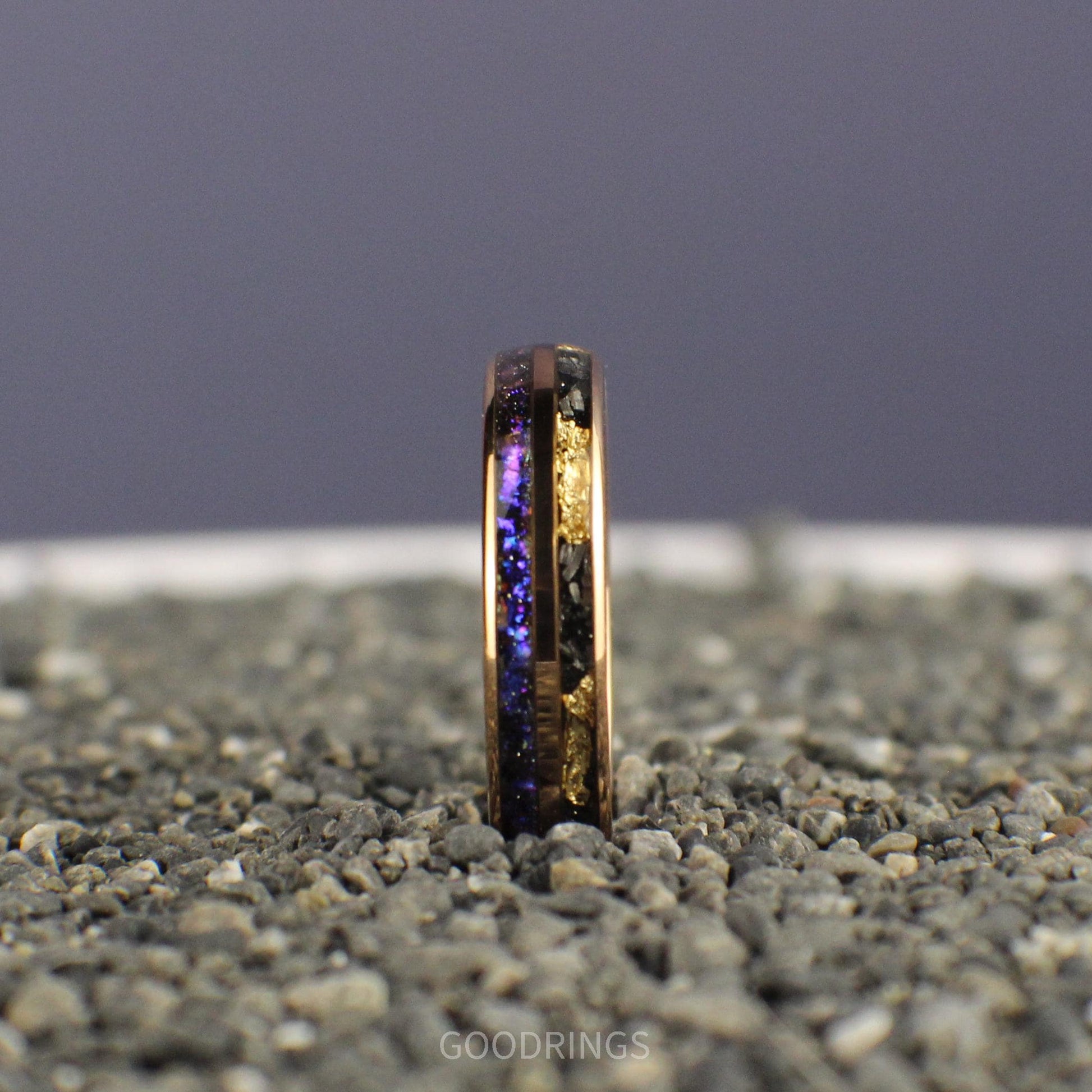 Elegant rose gold band inlaid with vibrant blue and purple opals, complemented by a sleek meteorite accent, symbolizing the beauty of the Earth and the cosmos in perfect harmony.