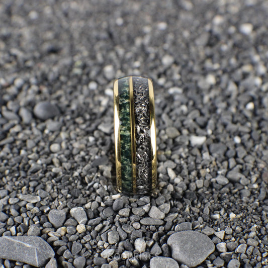 A sleek 8mm yellow gold ring with a domed design, featuring a mesmerizing meteorite inlay paired with earthy green moss agate.